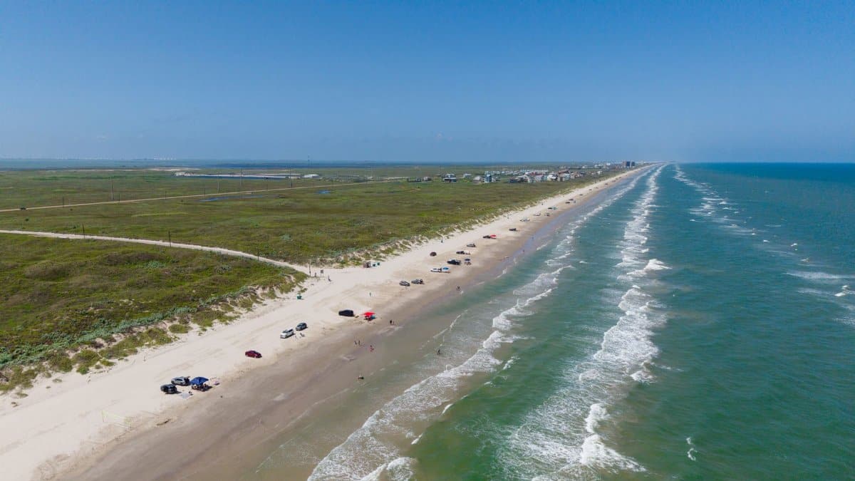 A scenic aerial view of Corpus Christi's coastline showcasing the Gulf of Mexico and sandy beaches.