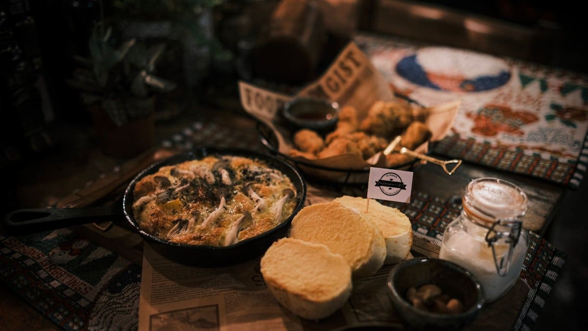 A warm, inviting rustic meal setup on a decorative tabletop, perfect for cozy gatherings.