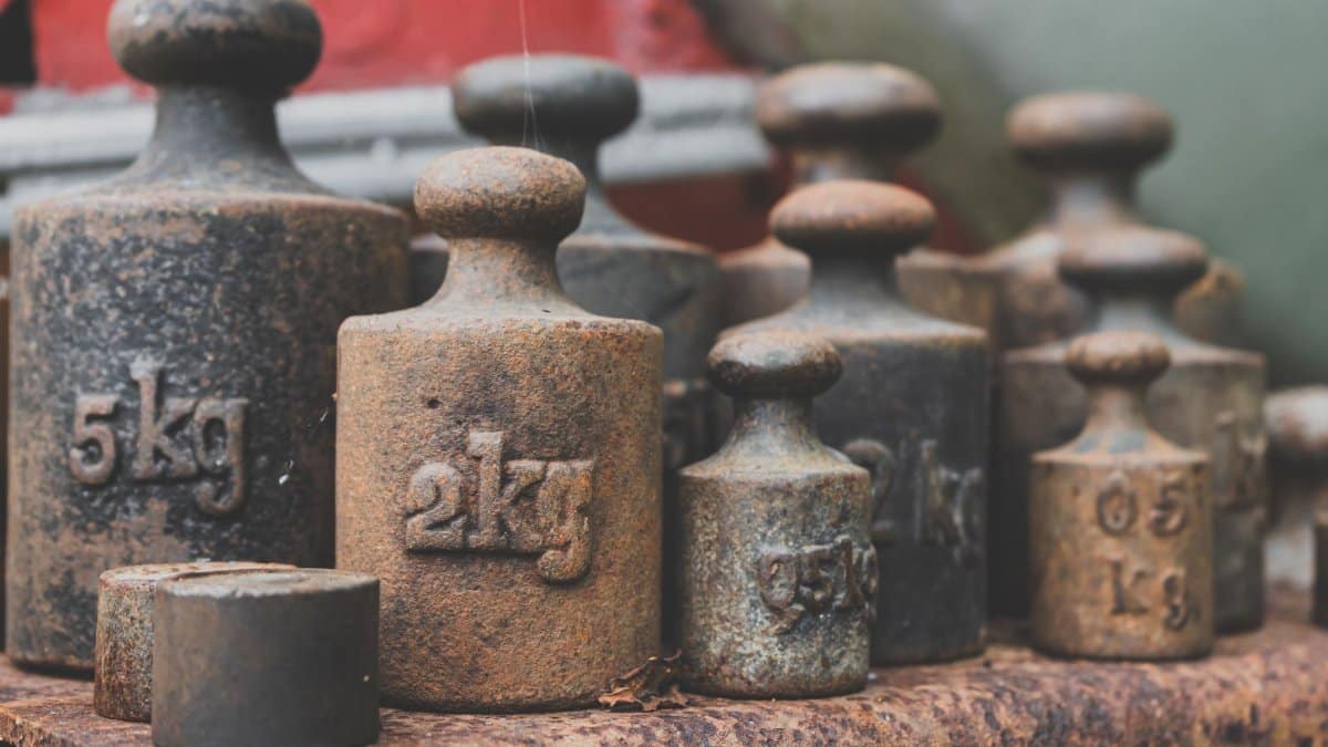 Close-up of various rusted iron weights illustrating antique and vintage appeal.