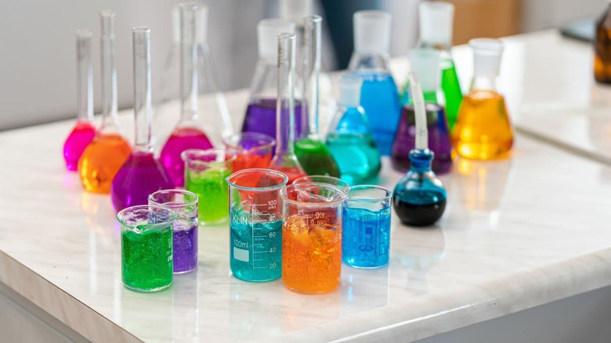 Vibrant laboratory glassware with colored liquids for chemistry experiments.