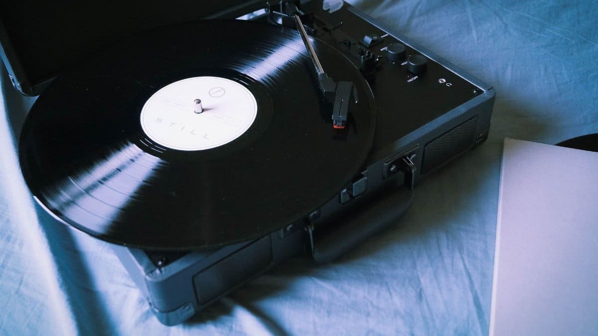 A classic vinyl record playing on a vintage turntable, evoking nostalgia and retro vibes.