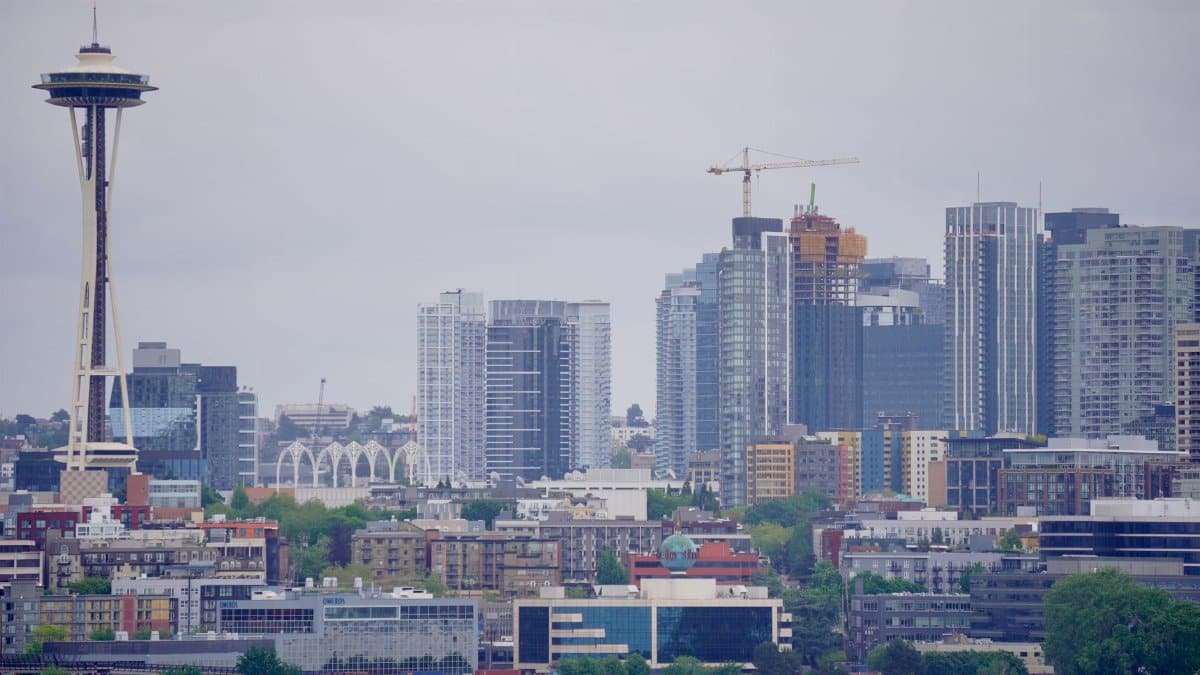 View of Seattle's iconic skyline with the Space Needle on a cloudy day.
