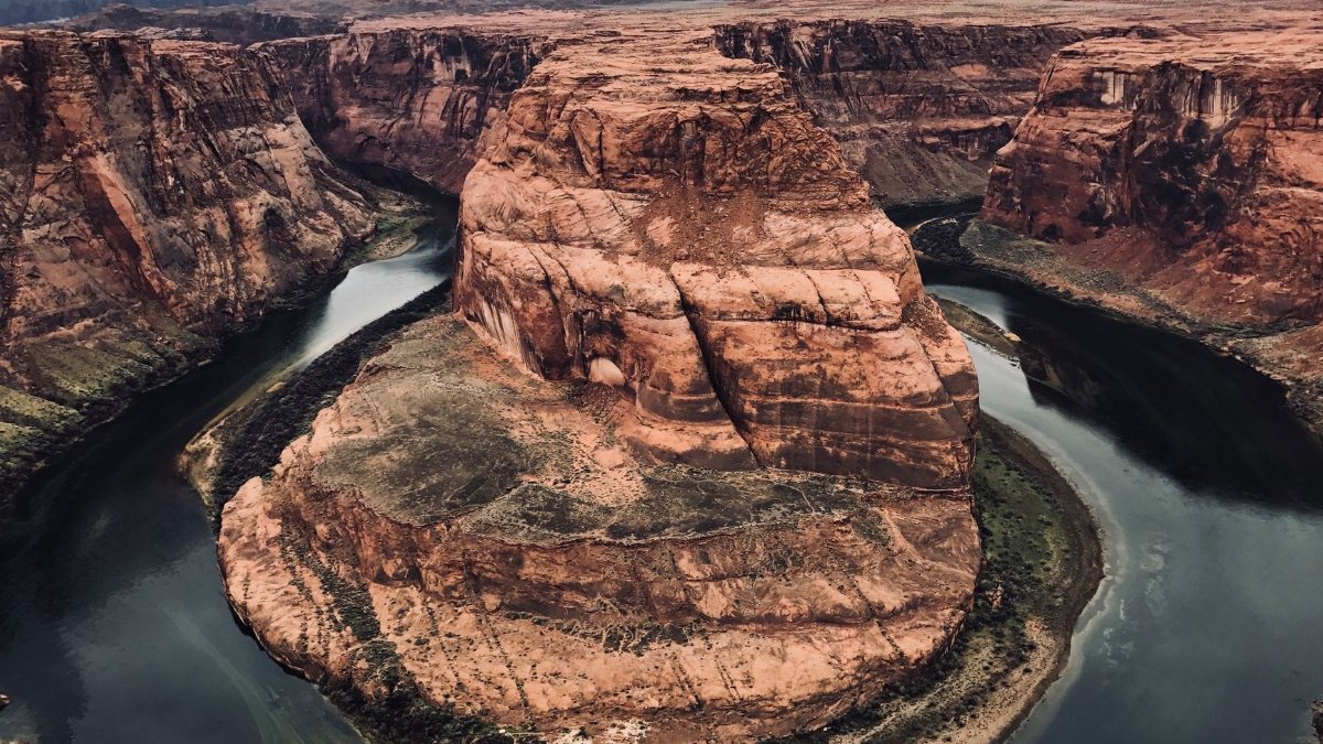 Breathtaking view of Horseshoe Bend in Page, Arizona with the Colorado River winding through the canyon.