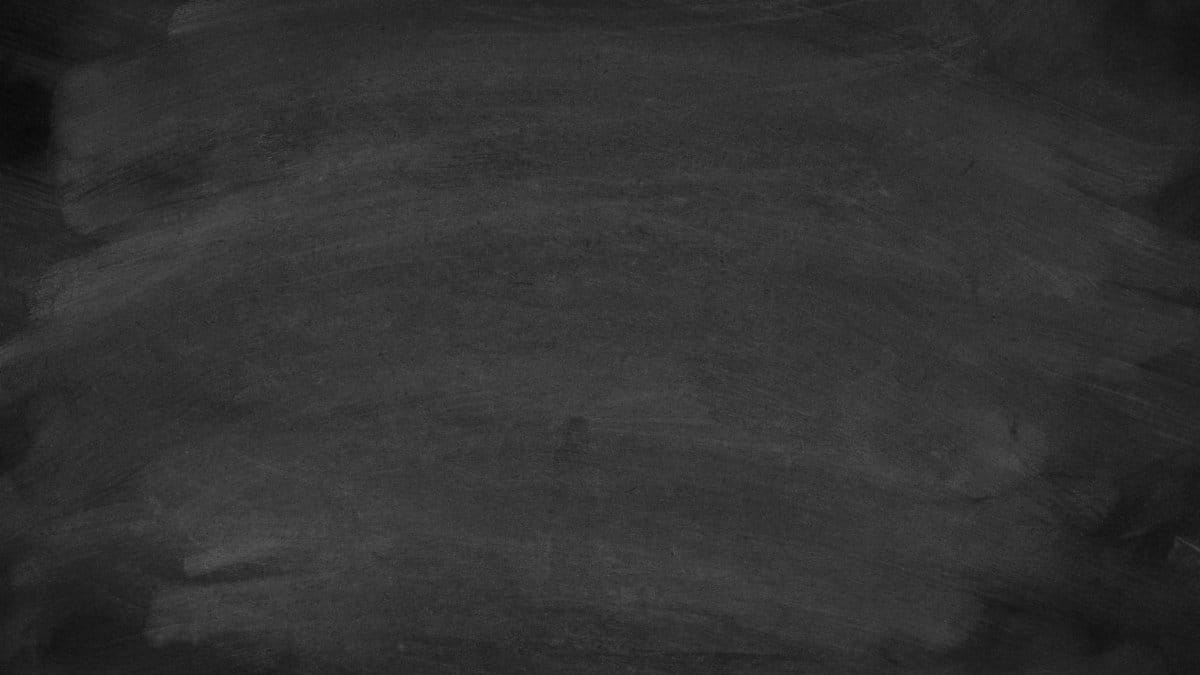 A high-resolution image of a blank blackboard showing chalk stains, ideal for educational themes.