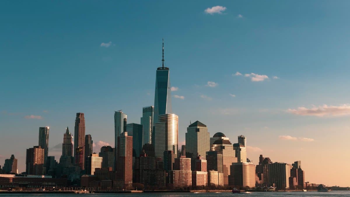 Stunning view of New York City skyline during sunset, highlighting iconic skyscrapers.