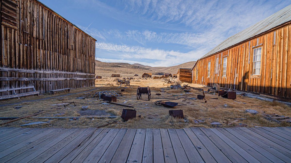 A glimpse into the past in Bodie, California's historic ghost town, showcasing its wooden buildings and desert landscape.