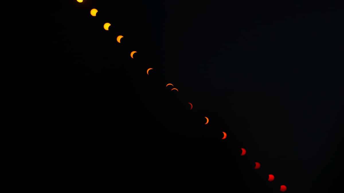 A captivating sequence of a solar eclipse photographed in the night sky over France.