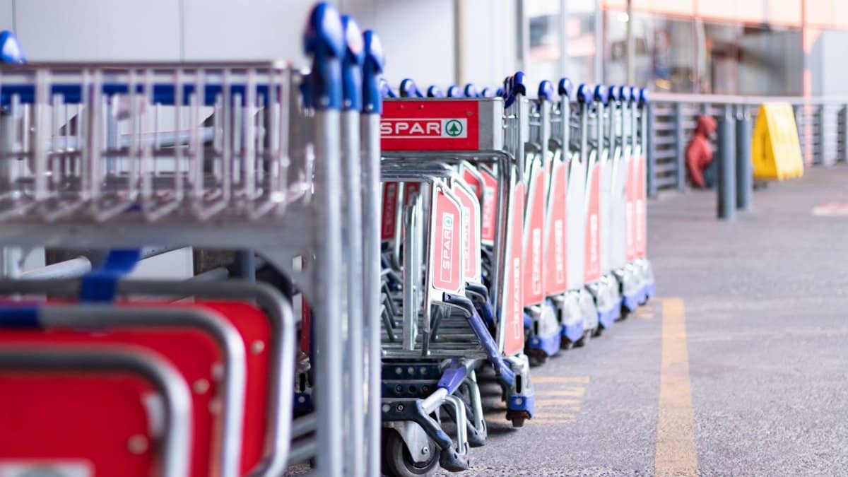 Row of trolleys outside a store in Johannesburg, South Africa, ready for shopper use.