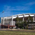 Panoramic view of RFK Stadium, showcasing its iconic architecture under a clear blue sky.