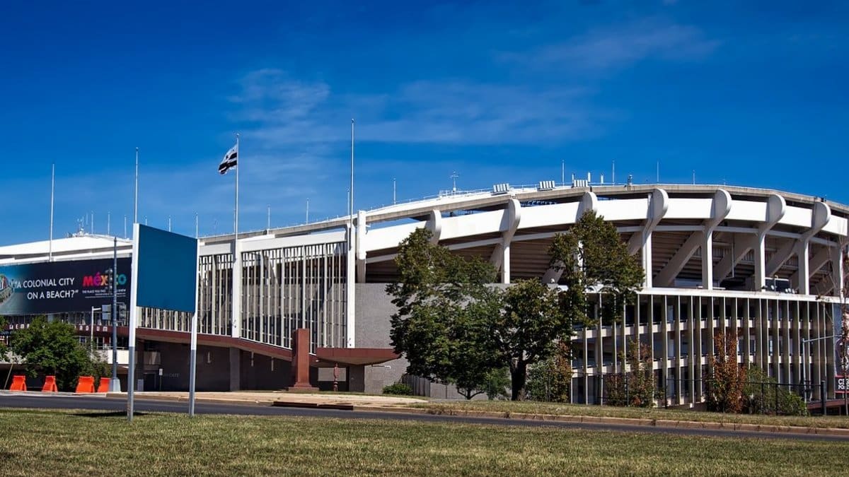 Panoramic view of RFK Stadium, showcasing its iconic architecture under a clear blue sky.