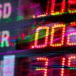 Vibrant stock market display showing exchange rates for USD, EUR, and GBP. Perfect for finance themes.