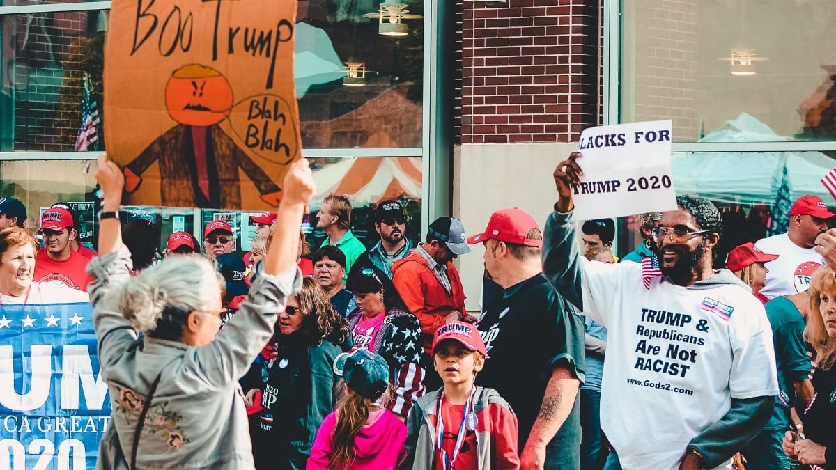 Protest and support dynamic at a political rally in Wheeling, West Virginia.