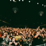 Lively audience enjoying a concert in Minneapolis, capturing the vibrant concert atmosphere.