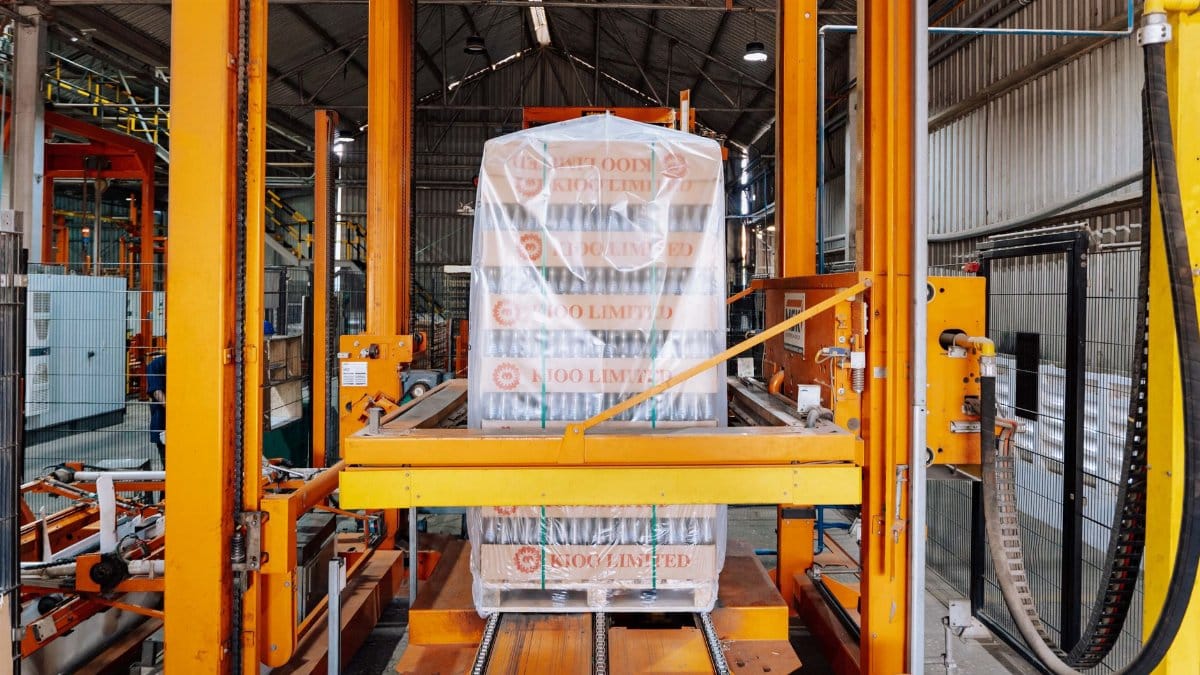 An industrial machine in a glass factory showcasing automated packaging in Dar es Salaam.