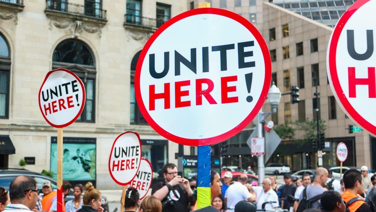 Active labor union demonstration in downtown Chicago advocating for workers' rights and unity.