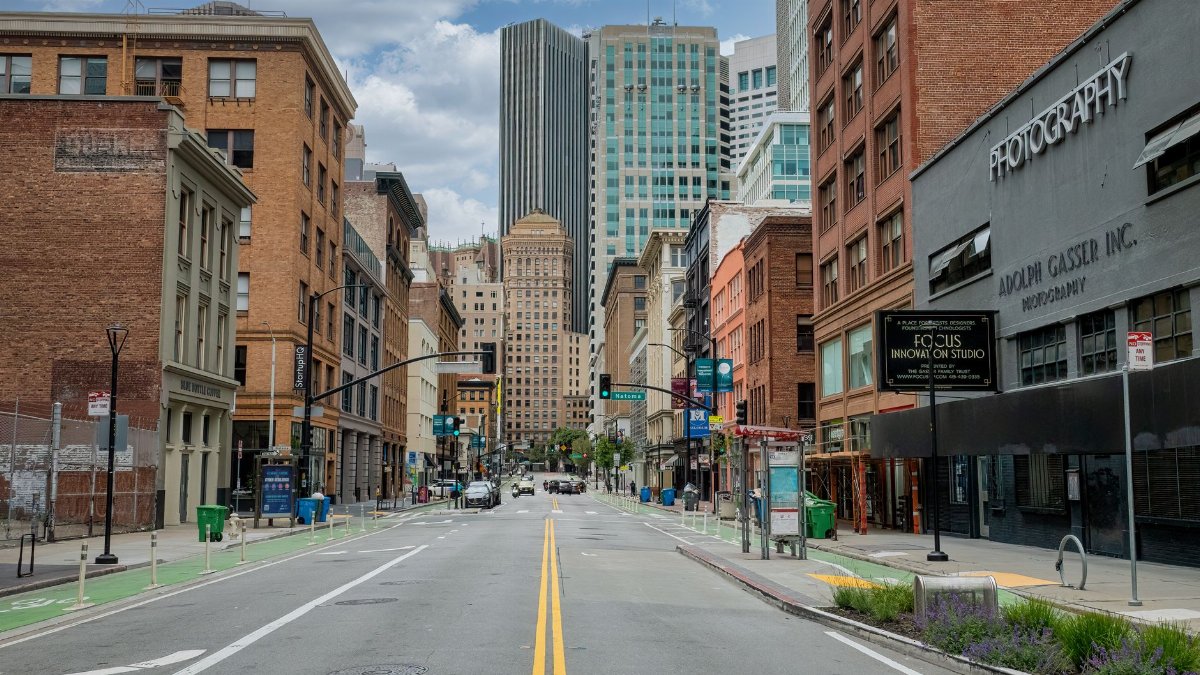 A clear day in downtown San Francisco showcasing urban architecture and empty streets.