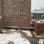 Snow-covered courtyard of University of Minnesota's Health Sciences Center in winter.