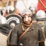 Viking reenactors in historical armor at a medieval festival in Szczecin, Poland.