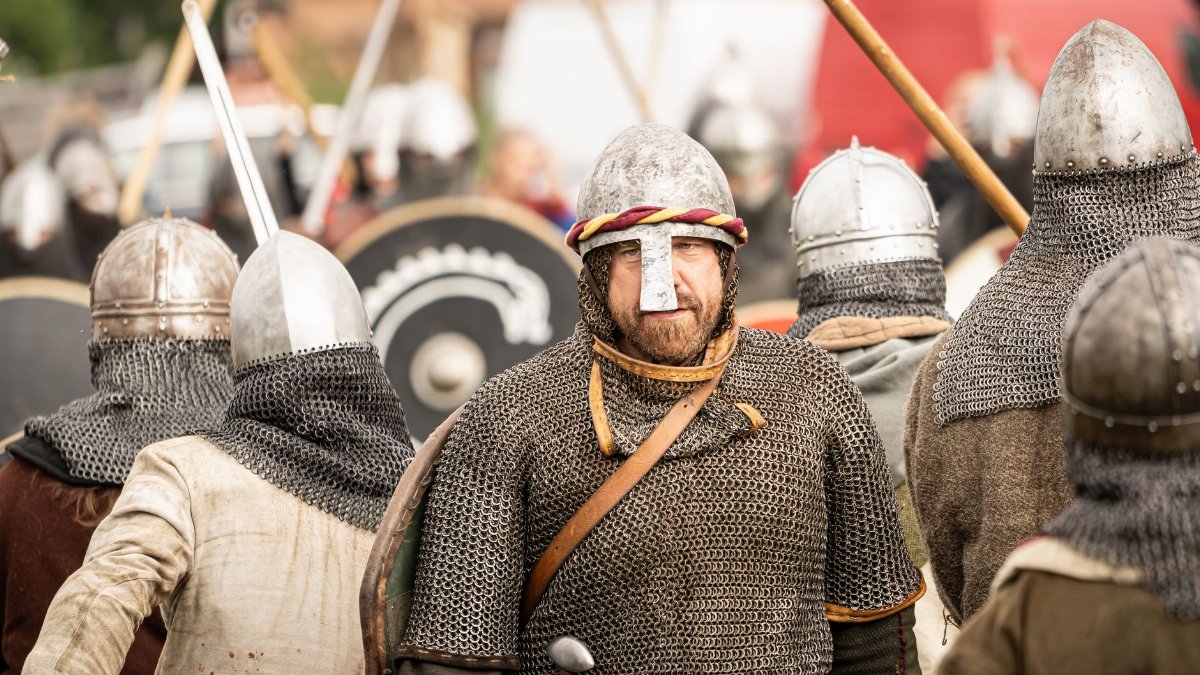 Viking reenactors in historical armor at a medieval festival in Szczecin, Poland.