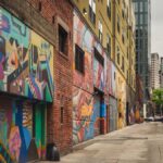 A colorful graffiti-covered alley in downtown Seattle showcasing urban street art.