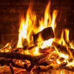 A close-up of a blazing fire in a cozy indoor fireplace in San Antonio, Texas.