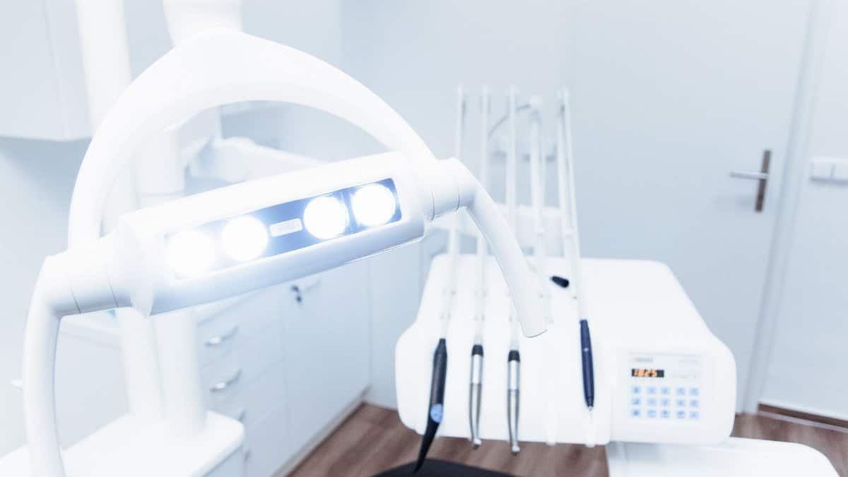 Bright and clean modern dental clinic room with advanced dental equipment.