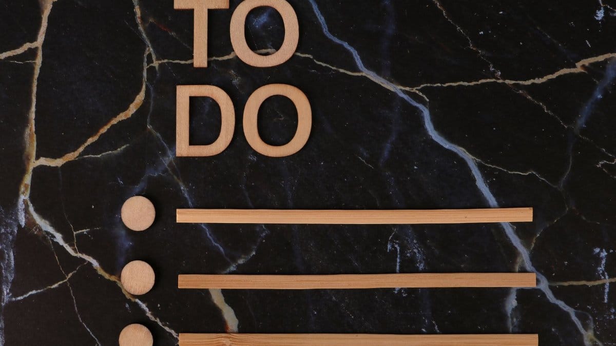 Wooden 'To Do' list design on dark marble background, perfect for productivity themes.