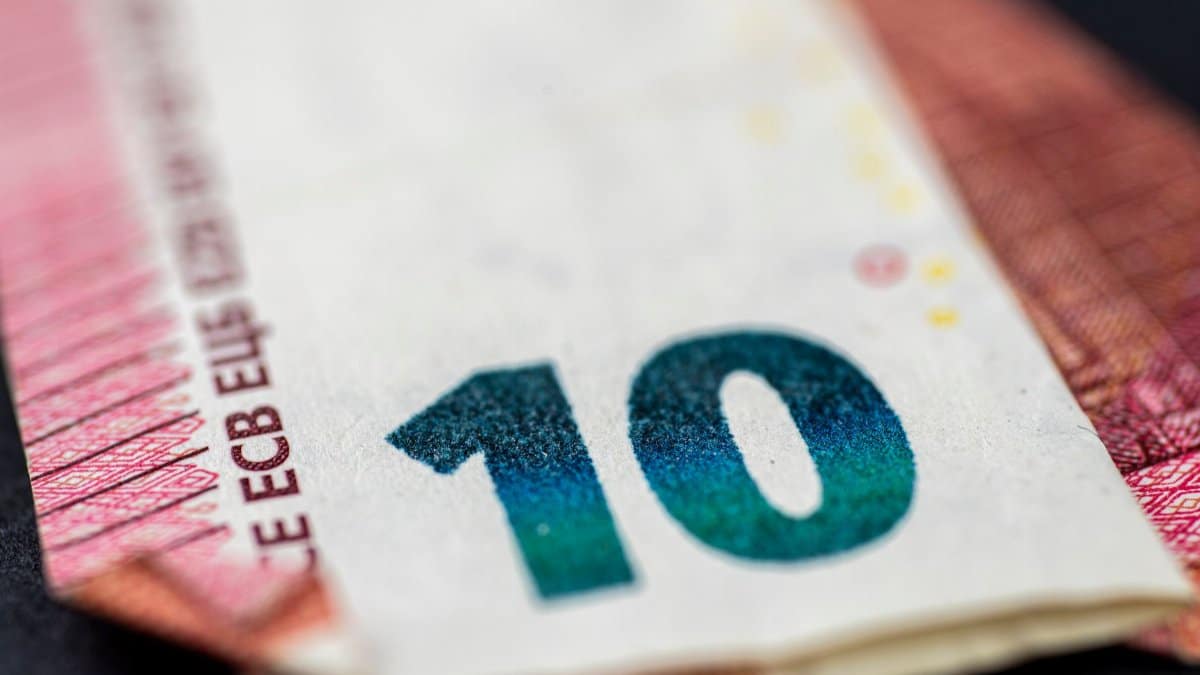 Detailed close-up of a ten euro banknote highlighting currency design and texture.