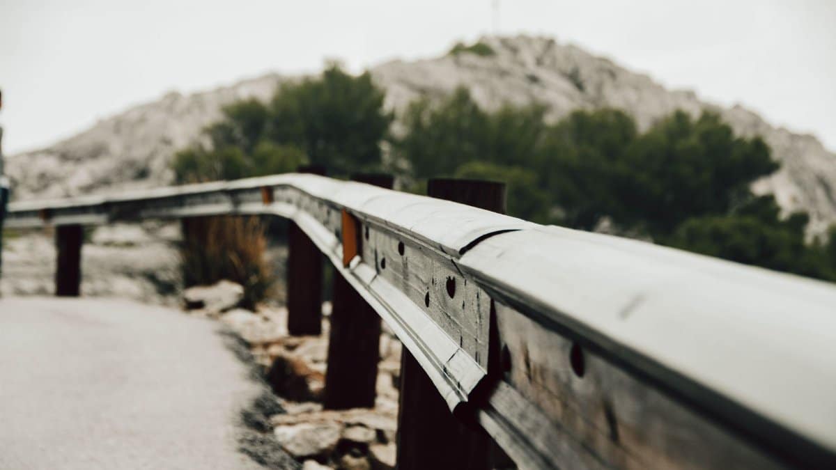 Close-up of a metal guardrail on a mountain road in Mallorca, Spain.
