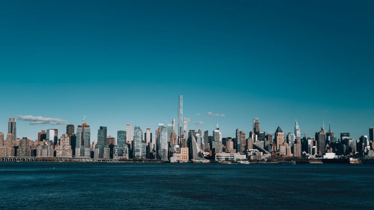 Stunning view of the New York City skyline with clear blue skies.