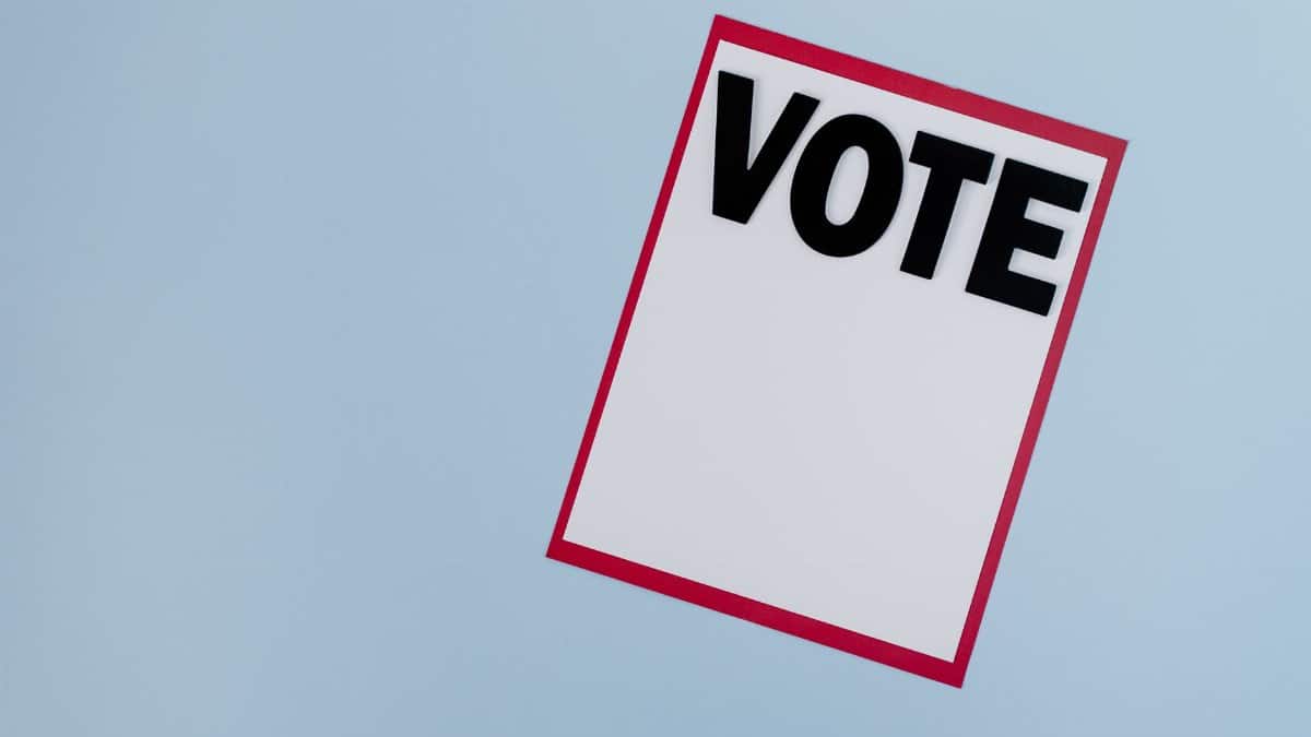 Minimalist vote card on a blue background, symbolizing election and democracy.