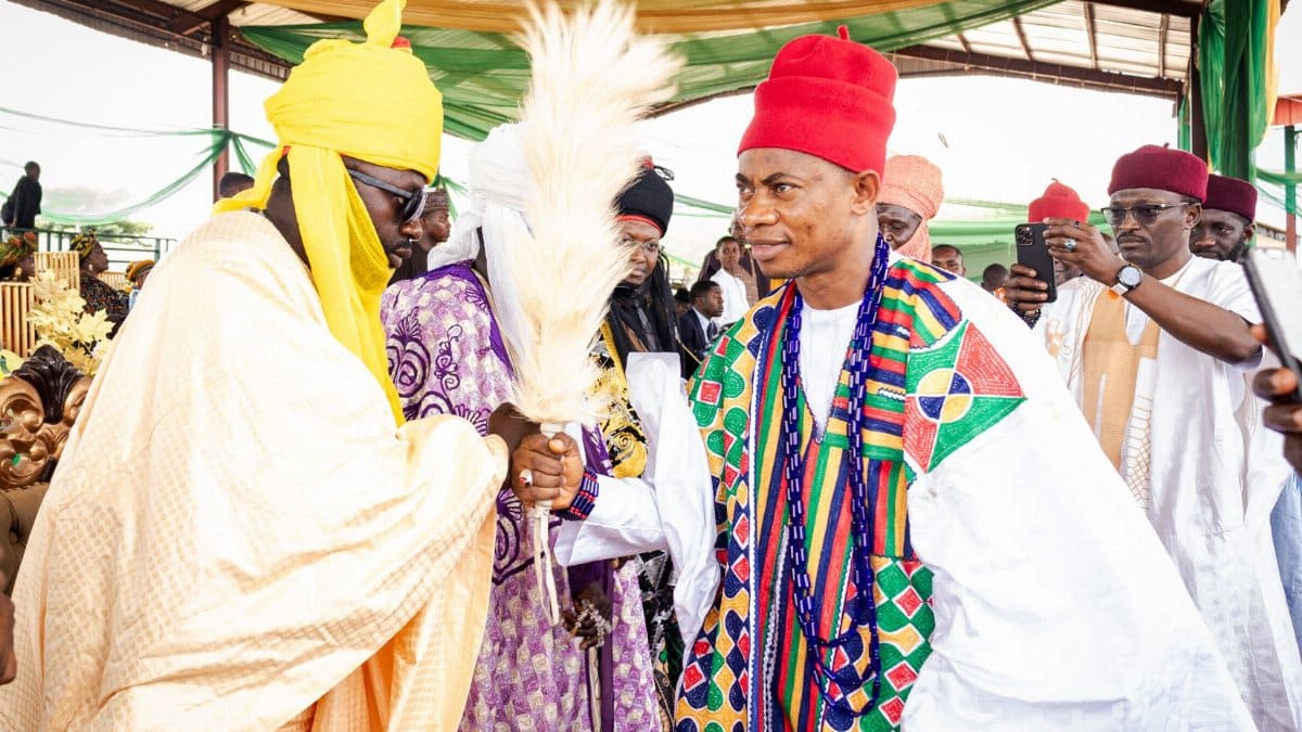 Vibrant Nigerian cultural ceremony showcasing traditional clothing and customs among respected local chiefs.
