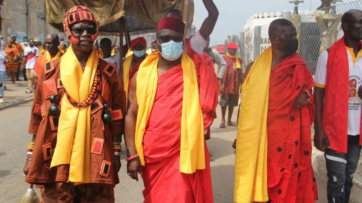 African chiefs in traditional attire walk during a cultural ceremony in Accra, Ghana.