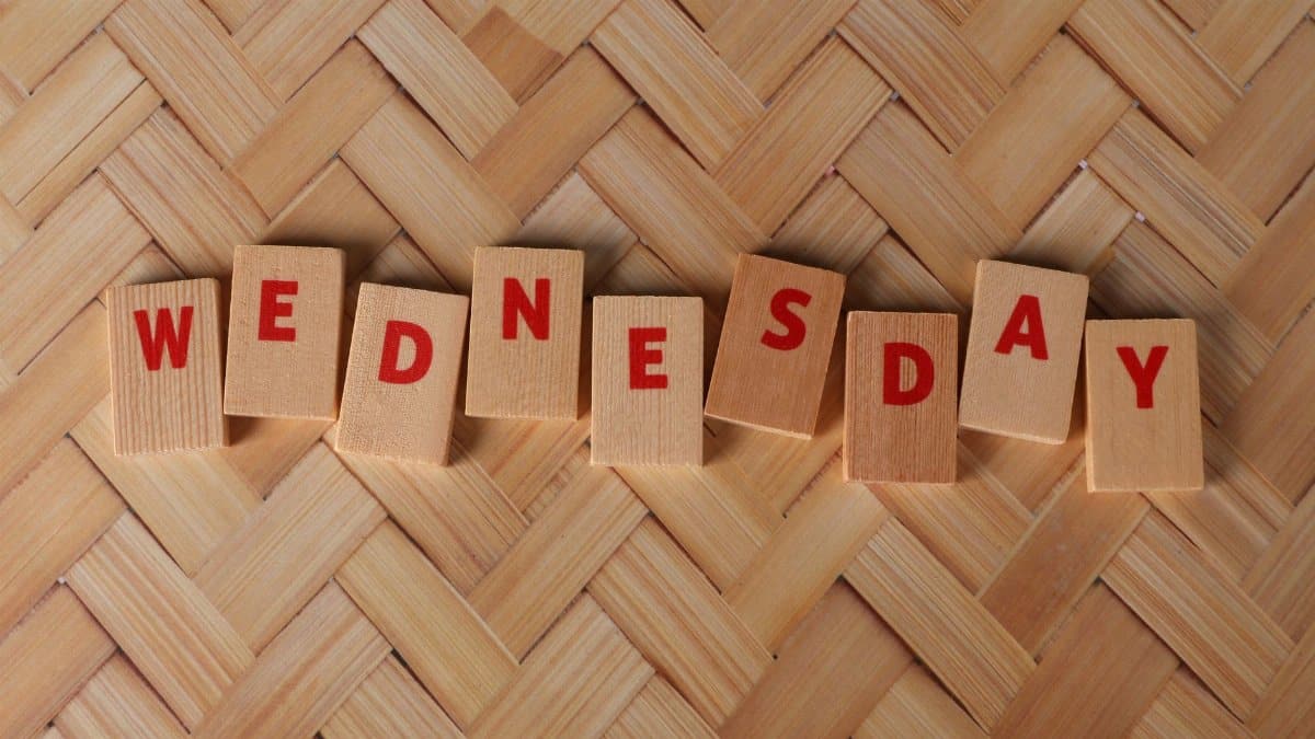 Wooden tiles display 'Wednesday' on a woven texture background, ideal for weekday themes.