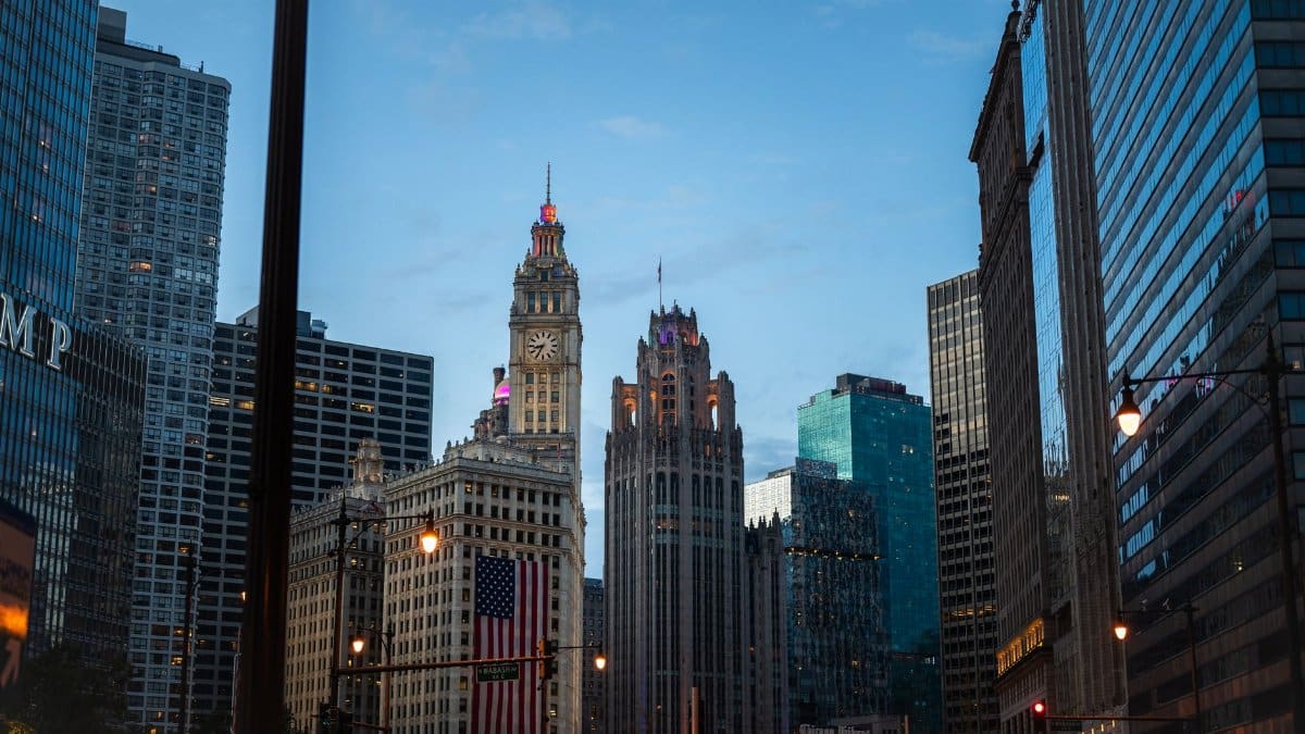 Evening view of the Chicago skyline with historic architecture and modern skyscrapers.