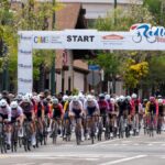 Exciting scene from the Redlands Bicycle Classic 2026, featuring a dynamic group of cyclists competing in a thrilling outdoor race.