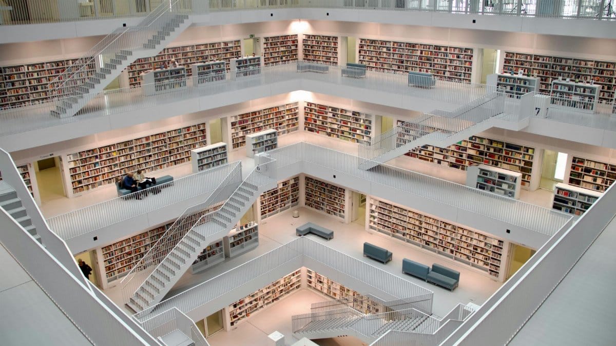 Spacious multi-story library interior in Stuttgart showcasing modern architecture and design.