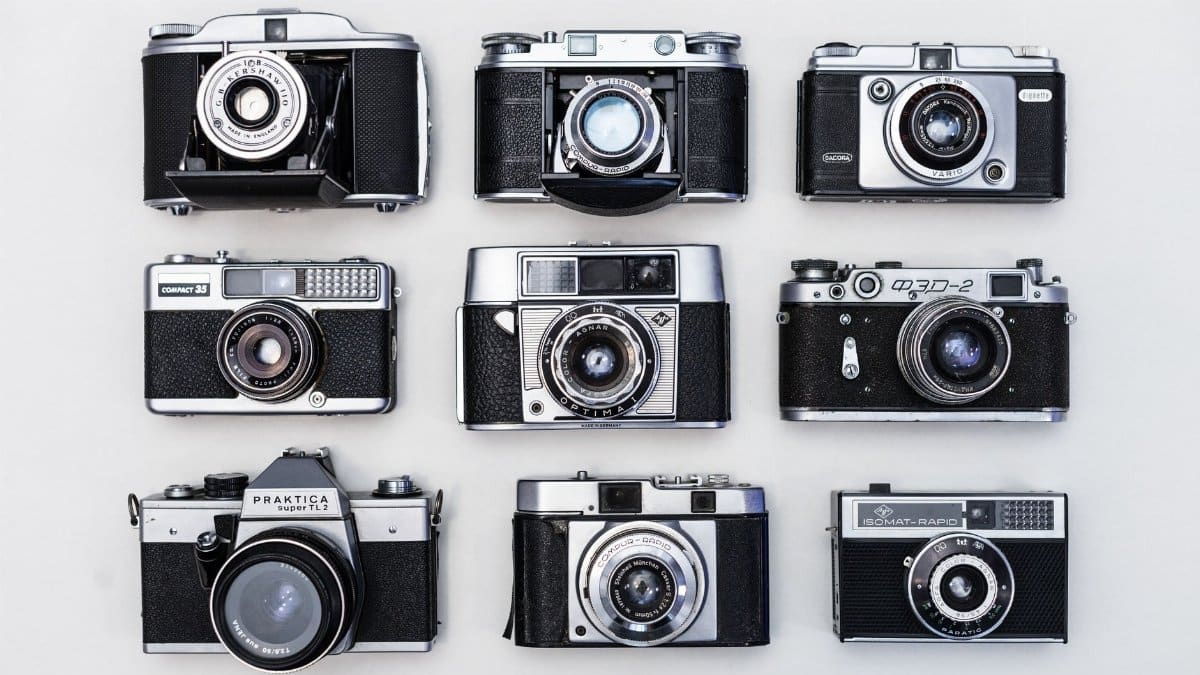 A flat lay of various vintage cameras showcasing classic photographic equipment.