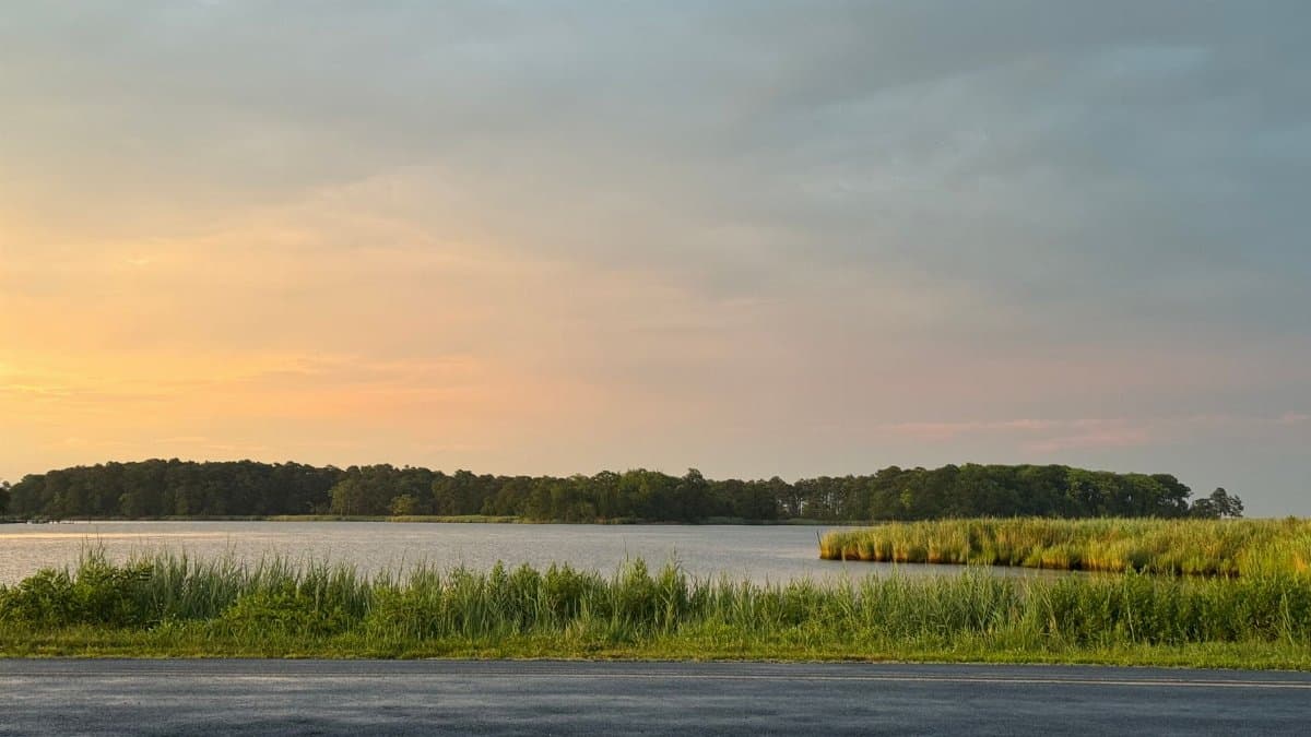 Explore the serene beauty of a sunset over a peaceful waterway in Rock Hall, Maryland.