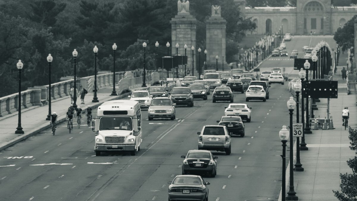 Busy day at Arlington Memorial Bridge, Washington D.C., showcasing diverse traffic activity.