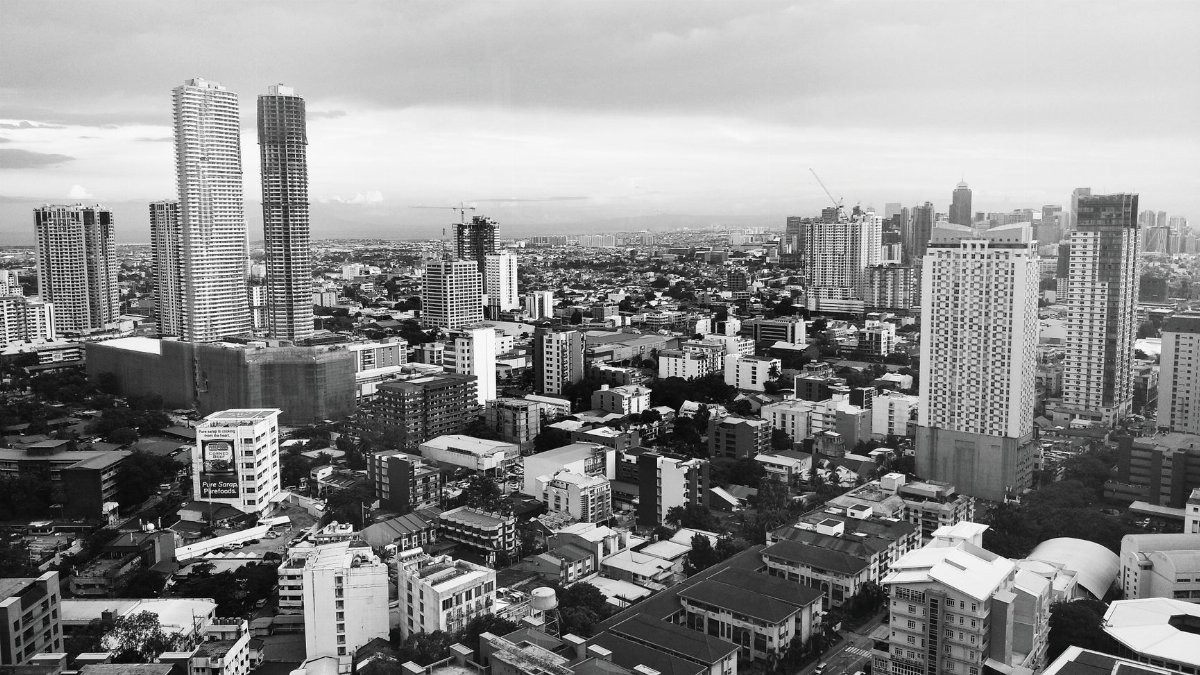 A high-angle black and white view of the sprawling urban landscape of Pasig City, Philippines.