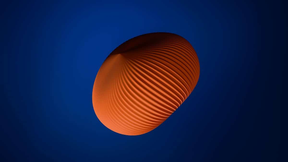 Abstract 3D orange sphere with geometric patterns on a deep blue background.