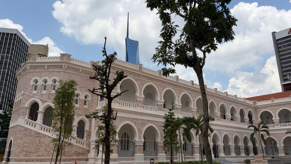 Elegant colonial design of a landmark building in Kuala Lumpur under a vibrant sky.