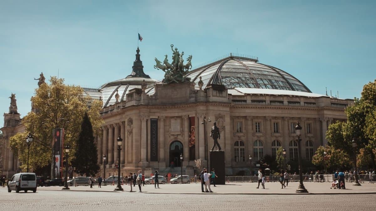 A captivating view of the Grand Palais in Paris, showcasing its iconic architecture under a clear blue sky.