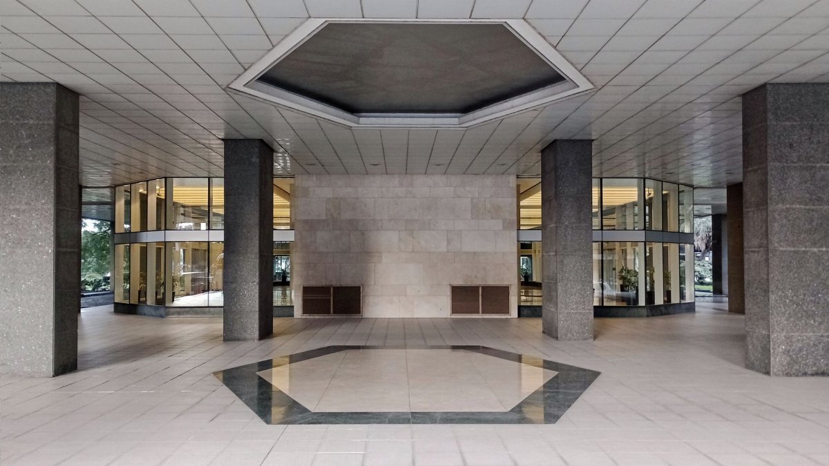 Contemporary lobby entrance with glass and columns in Buenos Aires, Argentina.