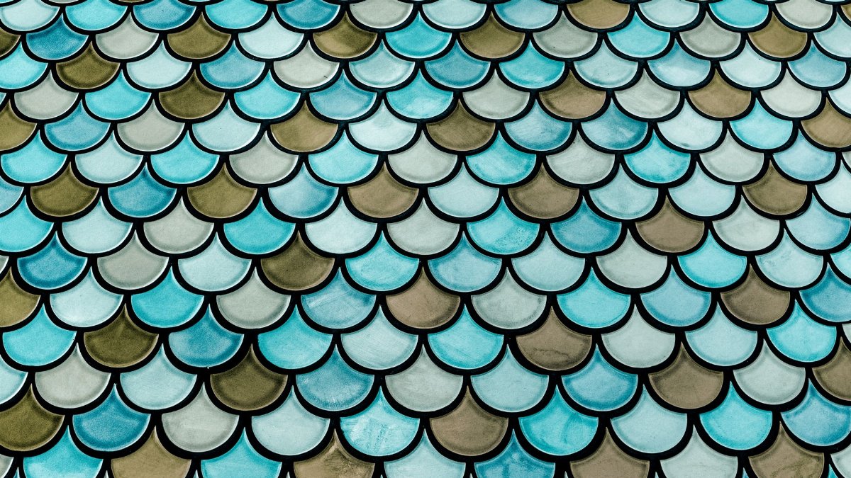 Eye-catching abstract scale pattern with blue hues, perfect for backgrounds and design projects.