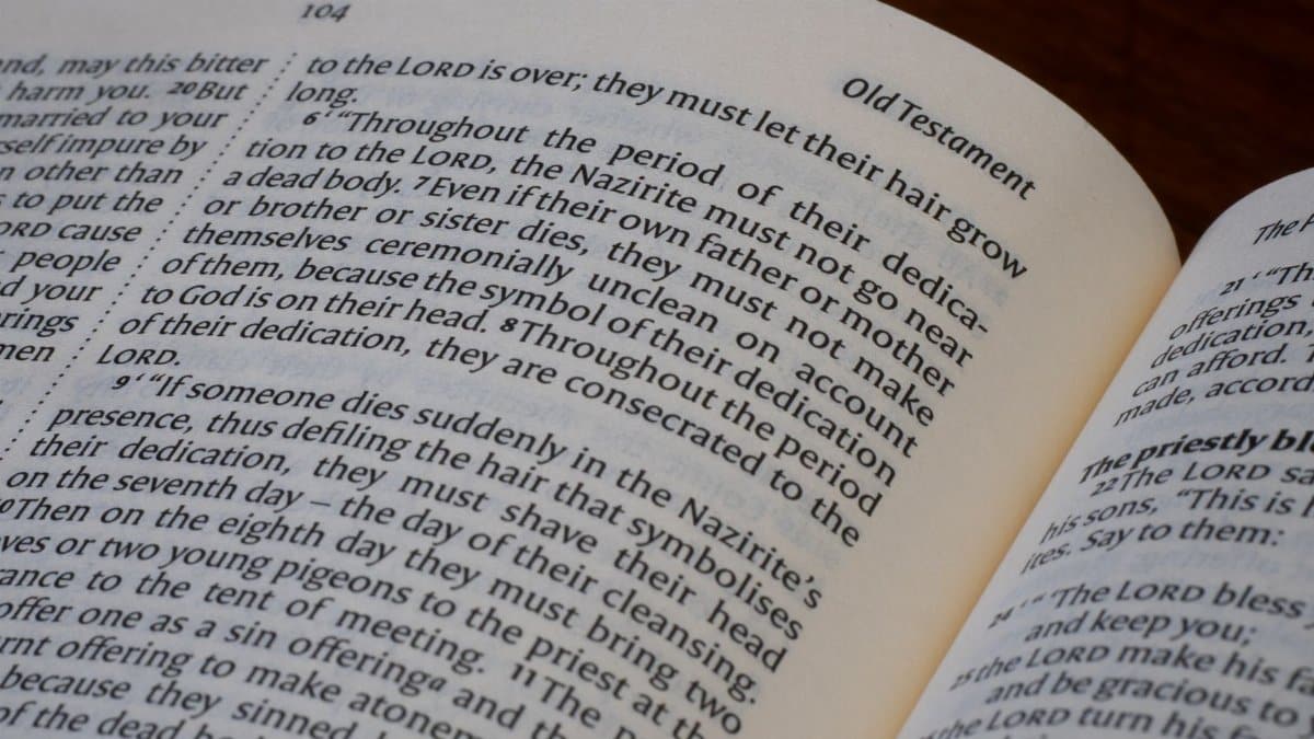Detailed close-up of an open Bible displaying text from the Old Testament.