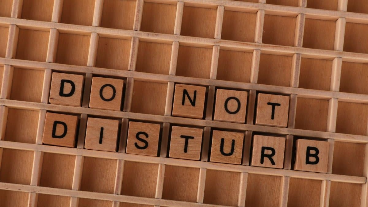 Wooden blocks spelling 'Do Not Disturb' arranged in a grid pattern.