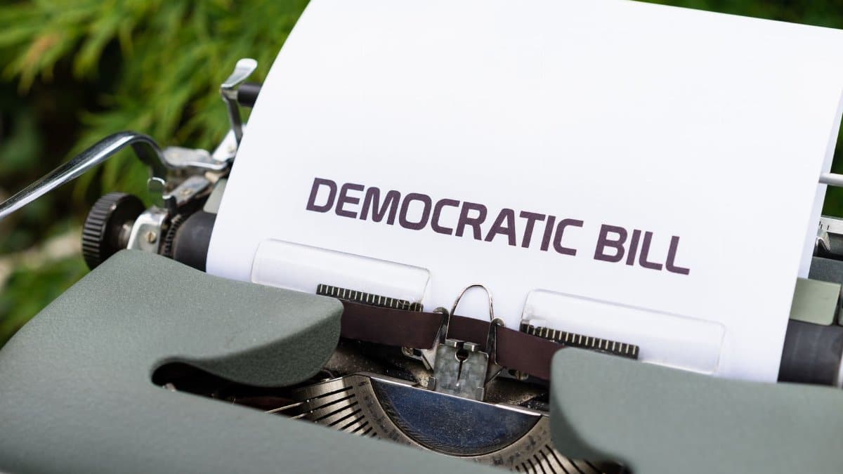 Close-up of a vintage typewriter printing a democratic bill, symbolizing government and legislative concepts.