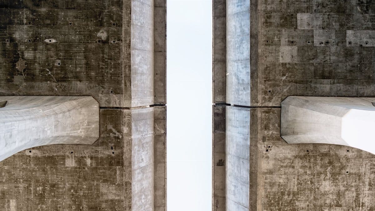 Close-up view of a symmetrical concrete structure showcasing texture and geometry.